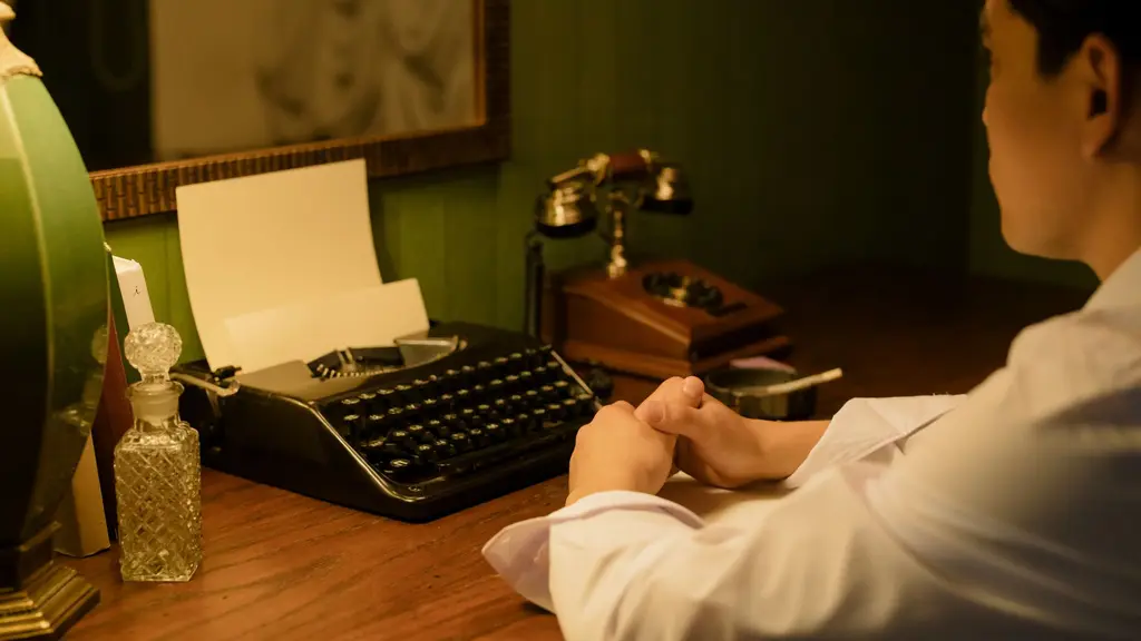 a pen resting on an open notebook beside a window at first light