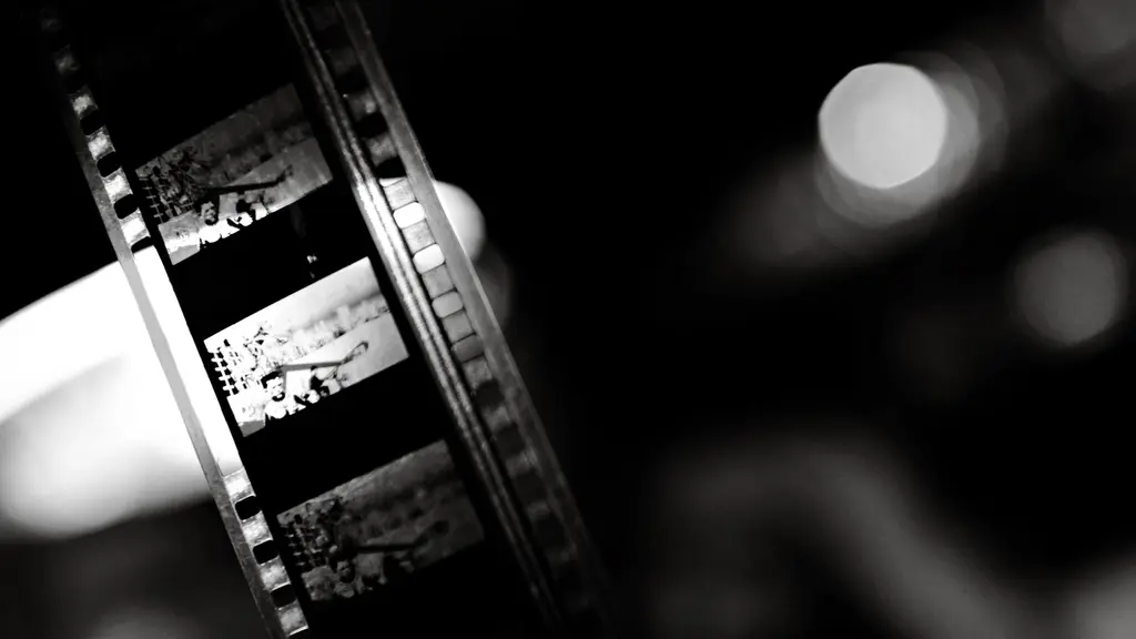 an assistant director mid-stride across a set holding a radio